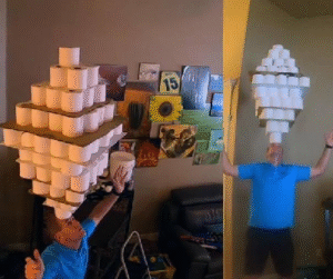 David Rush Balances 254 Toilet Paper Rolls on His Head, Sets World Record
