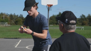 Canadian Teen’s Unusual Pogo Stick Rubik’s Cube Record Still Stands